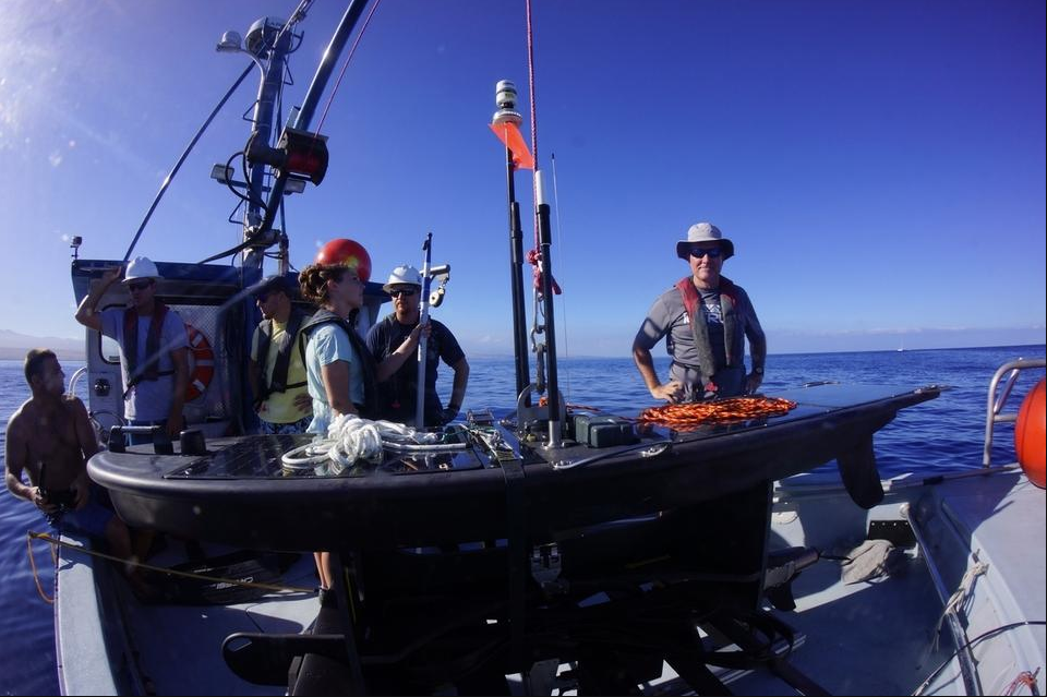 ThayerMahan CEO Mike Connor, right, stood with support teams from OASIS and Liquid Robotics as the company's robotic systems underwent sea trials off the Big Island of Hawaii in September of 2016.